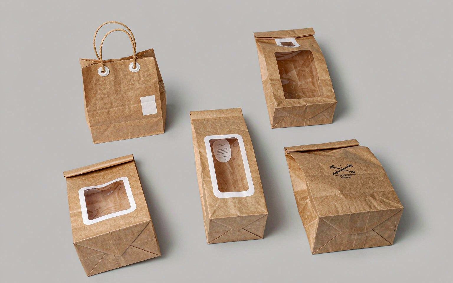 Assortment of brown kraft paper bags: square bottom bag with twisted paper handles, bakery bag with window, V bottom food bag and printed takeaway bag